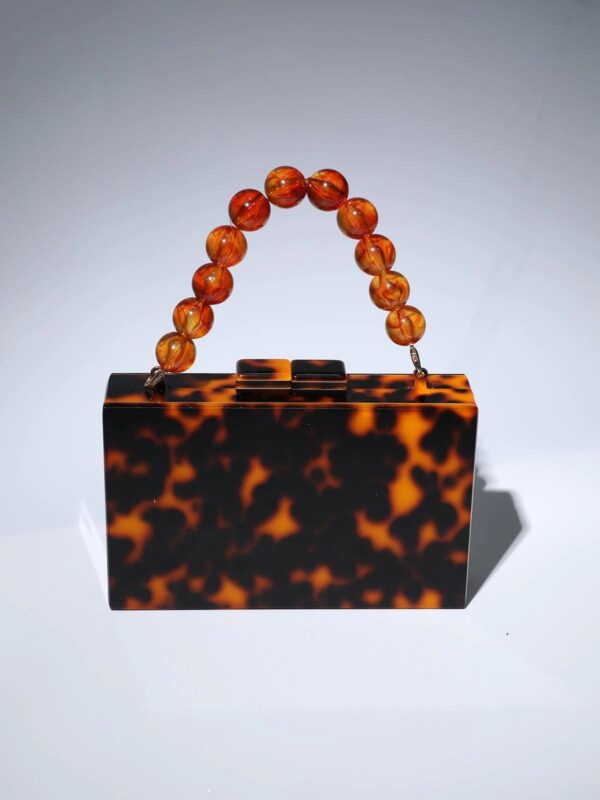 sama acrylic beaded clutch in amber 6